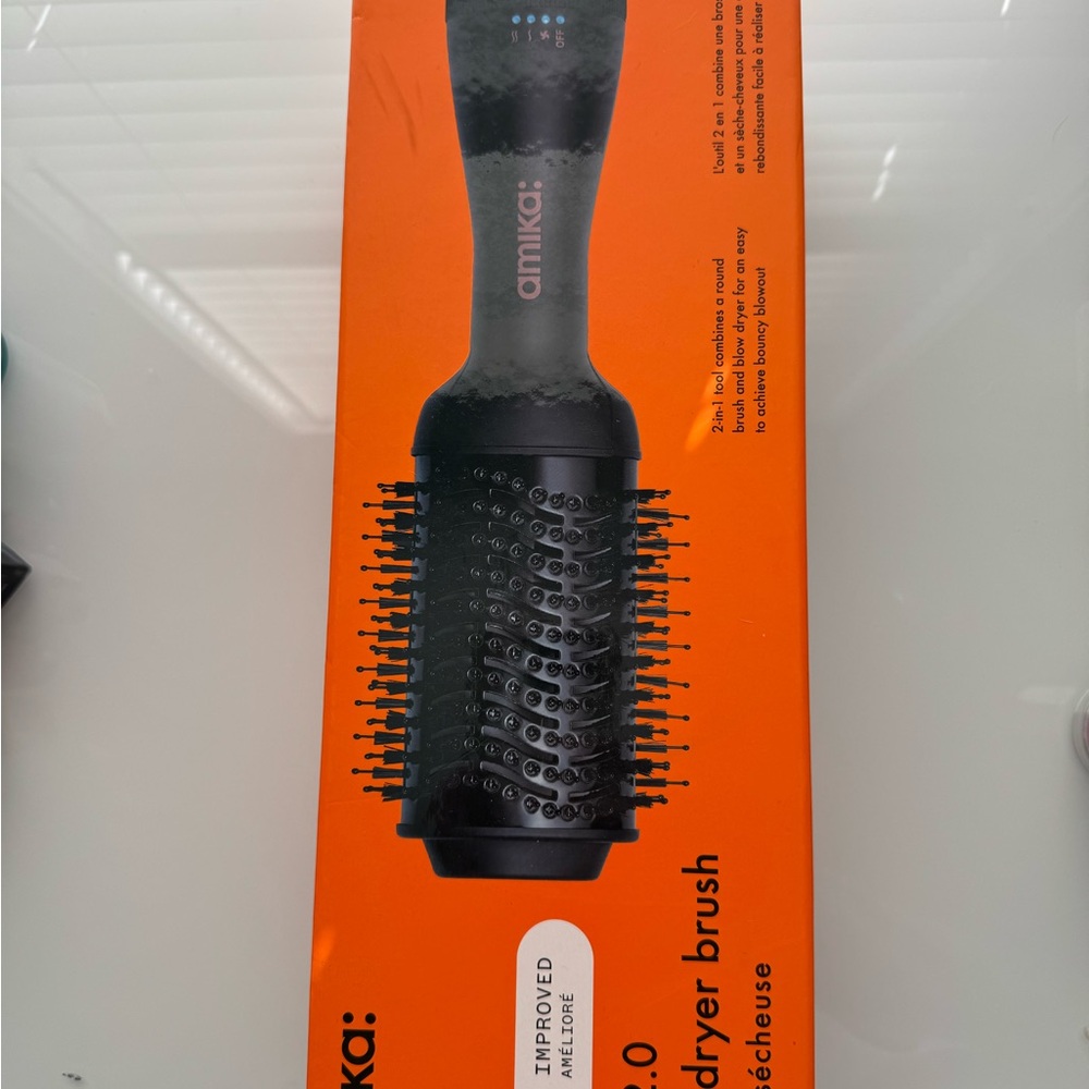 Amika Hair Dryer Brush in Black and Vibrant Orange